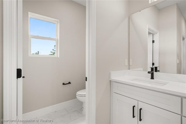 4924 San Lorenzo Dr, Sebring, FL 33872 - bathroom featuring vanity, marble finish floor, baseboards, and toilet