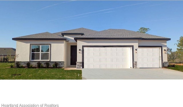 prairie-style home featuring a garage