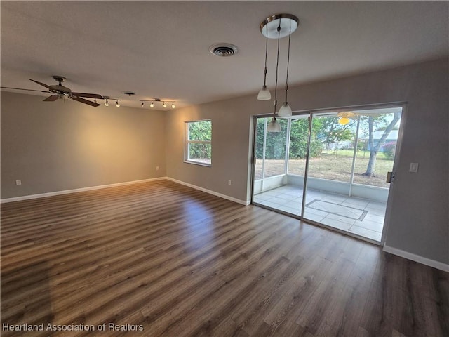 interior space with ceiling fan and dark wood-type flooring