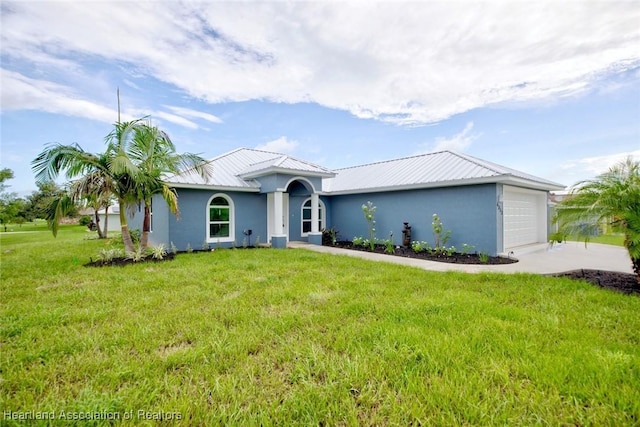 single story home with a garage and a front lawn