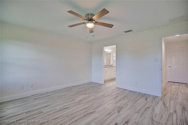 spare room with ceiling fan and light hardwood / wood-style floors