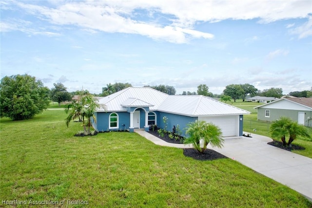 single story home featuring a front lawn and a garage