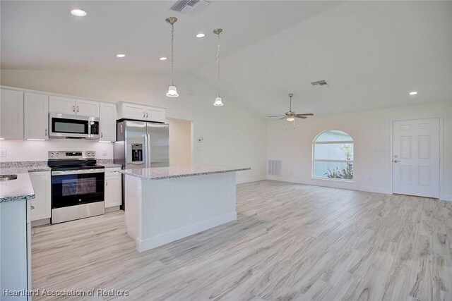 kitchen featuring stainless steel appliances, ceiling fan, pendant lighting, light hardwood / wood-style flooring, and white cabinetry