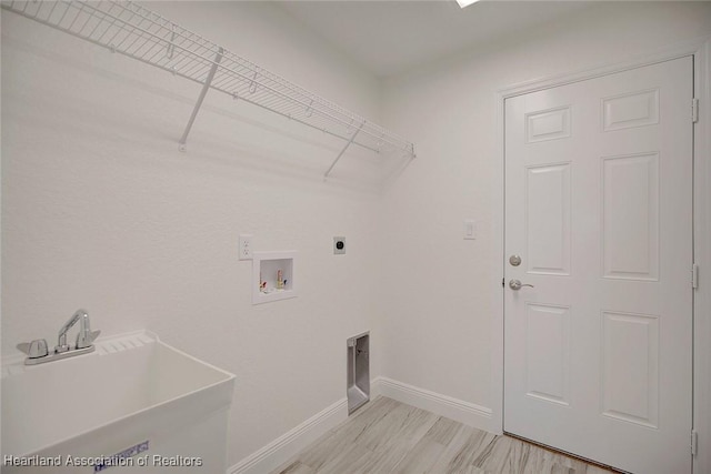 laundry room with washer hookup, electric dryer hookup, and sink