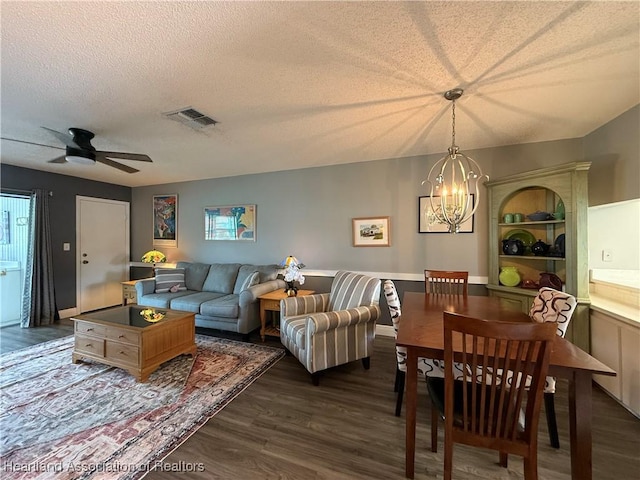 3711 Perugia Ave, Sebring, FL 33872 - living area featuring a textured ceiling, a chandelier, dark wood-type flooring, and a ceiling fan