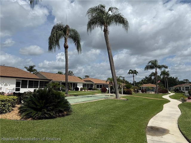 3711 Perugia Ave, Sebring, FL 33872 - view of home's community with shuffleboard, a lawn, and a residential view