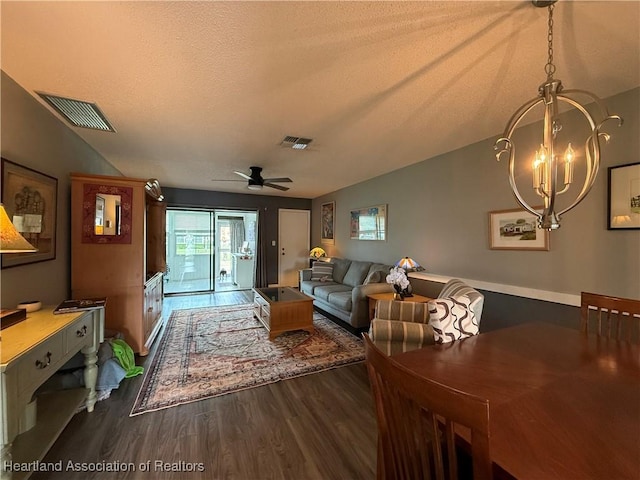 3711 Perugia Ave, Sebring, FL 33872 - living area with dark wood-type flooring, a chandelier, a textured ceiling, and ceiling fan