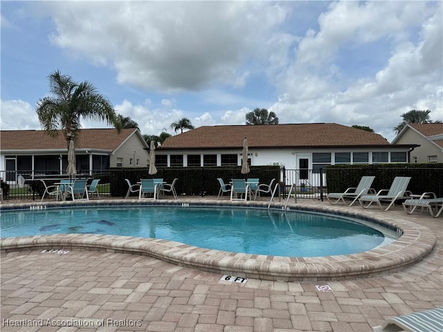 3711 Perugia Ave, Sebring, FL 33872 - community pool with fence and a patio