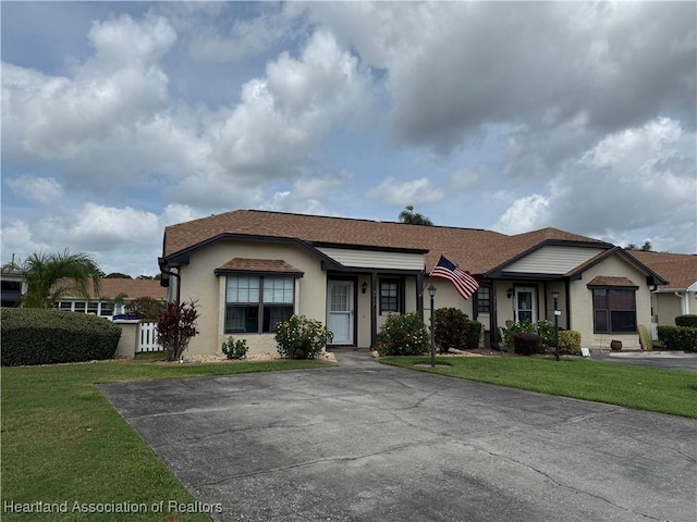 3711 Perugia Ave, Sebring, FL 33872 - ranch-style home with a front lawn and stucco siding