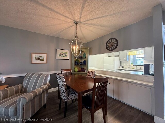 3711 Perugia Ave, Sebring, FL 33872 - dining area with dark wood-style flooring, a chandelier, and a textured ceiling