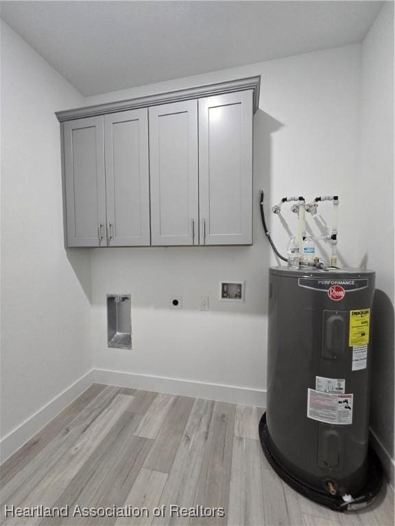 laundry area featuring cabinets, washer hookup, hookup for an electric dryer, water heater, and light hardwood / wood-style flooring