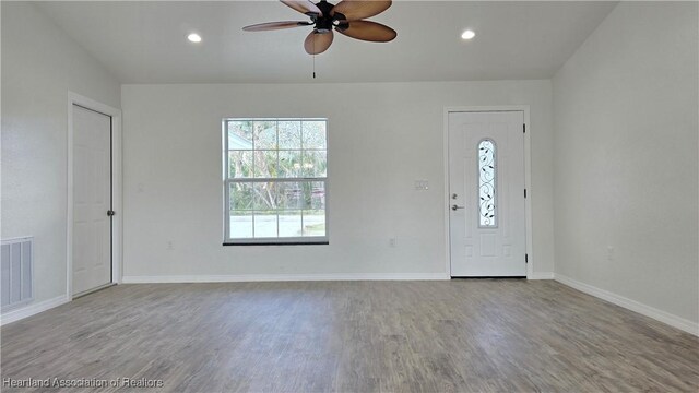 entrance foyer featuring ceiling fan and light wood-type flooring