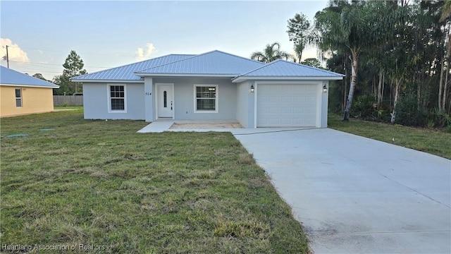 ranch-style home with a garage and a front lawn