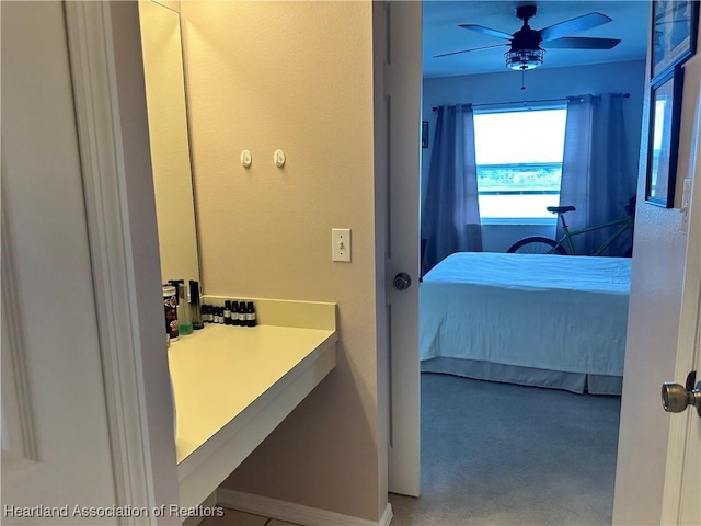 ensuite bathroom featuring ceiling fan, ensuite bathroom, and vanity