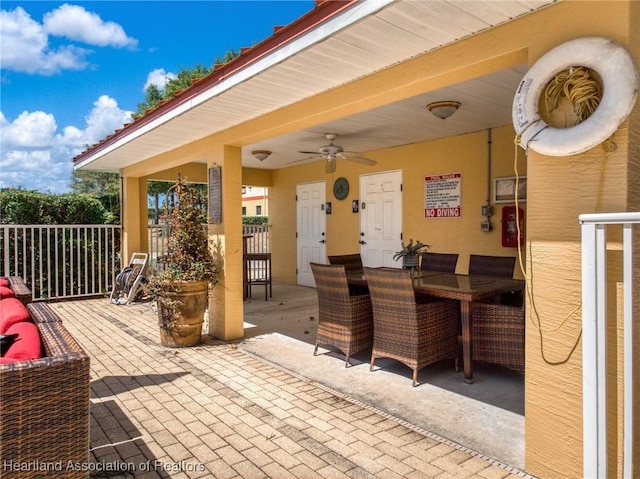 view of patio / terrace with outdoor dining space and ceiling fan