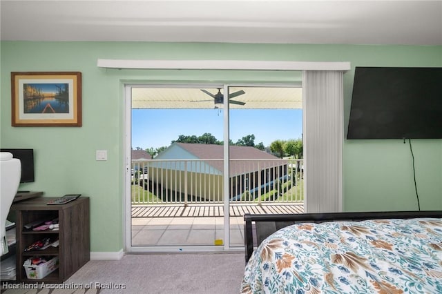 bedroom featuring carpet flooring, multiple windows, and access to outside
