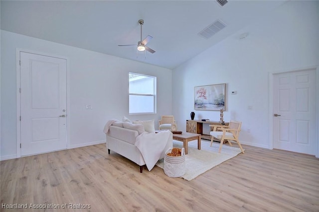 living room with a ceiling fan, baseboards, light wood-style floors, and visible vents