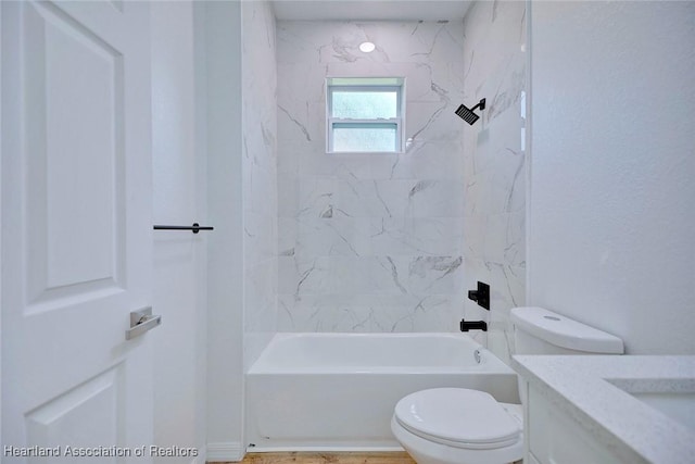 bathroom with toilet, vanity, and shower / bath combination