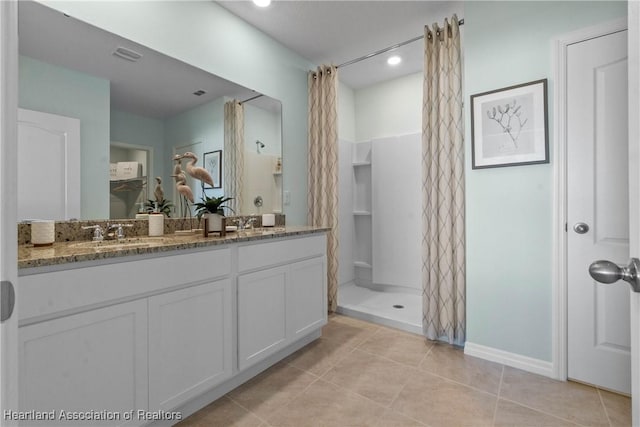 6856 Coconut Dr, Sebring, FL 33872 - bathroom featuring double vanity, tile patterned floors, a shower with curtain, and baseboards