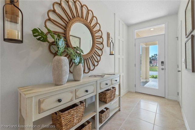 6856 Coconut Dr, Sebring, FL 33872 - entryway featuring baseboards and light tile patterned flooring