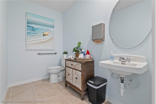 6856 Coconut Dr, Sebring, FL 33872 - bathroom with toilet, tile patterned flooring, and baseboards