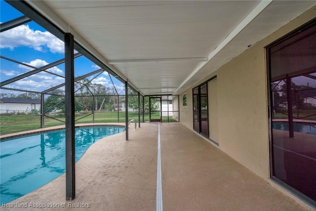 view of pool featuring a lanai and a patio area