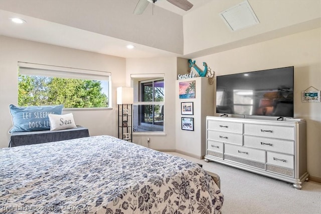 bedroom featuring visible vents, light colored carpet, and baseboards