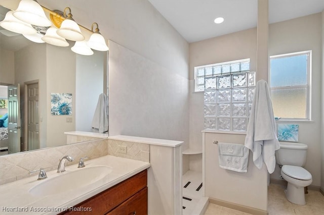 full bathroom with toilet, a walk in shower, recessed lighting, tile patterned flooring, and vanity