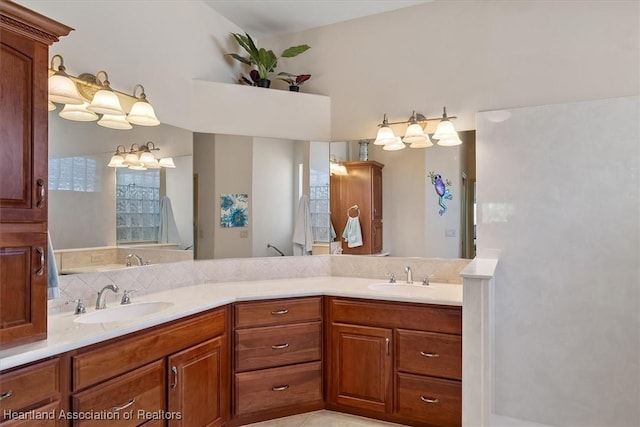 full bath with double vanity, decorative backsplash, and a sink