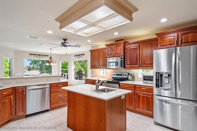 kitchen with a sink, tasteful backsplash, appliances with stainless steel finishes, and recessed lighting