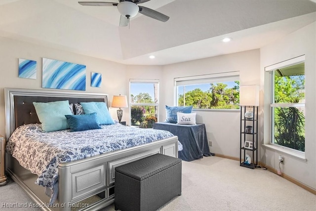 bedroom featuring baseboards, light colored carpet, vaulted ceiling, recessed lighting, and a ceiling fan