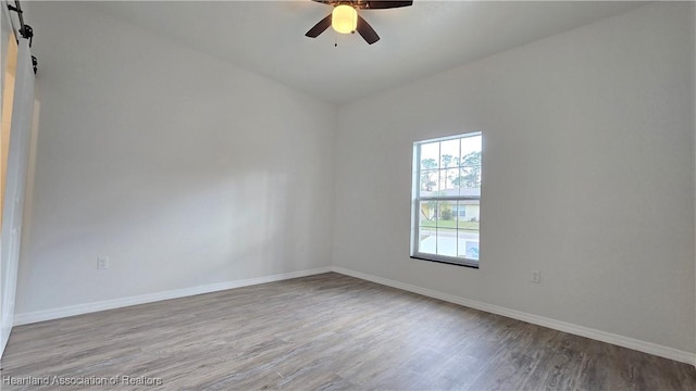 empty room featuring ceiling fan and light hardwood / wood-style flooring