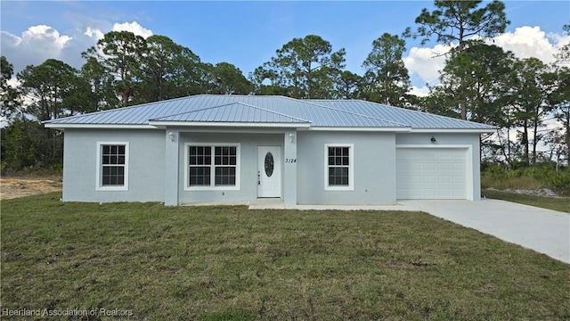 ranch-style house featuring a garage and a front yard