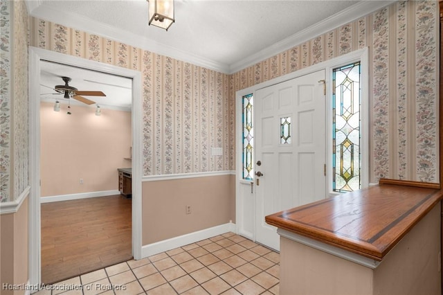 302 S Egret St, Sebring, FL 33870 - foyer entrance featuring crown molding, ceiling fan, light tile patterned floors, and baseboards