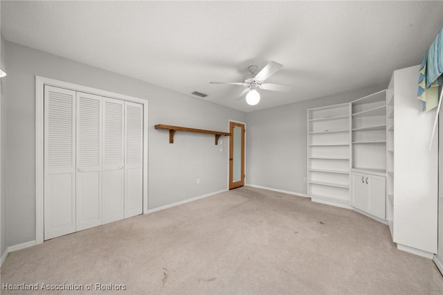 302 S Egret St, Sebring, FL 33870 - unfurnished bedroom featuring light carpet, baseboards, a closet, and a ceiling fan