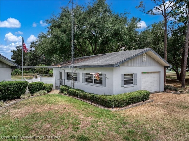 302 S Egret St, Sebring, FL 33870 - ranch-style house featuring stucco siding, an attached garage, and a shingled roof