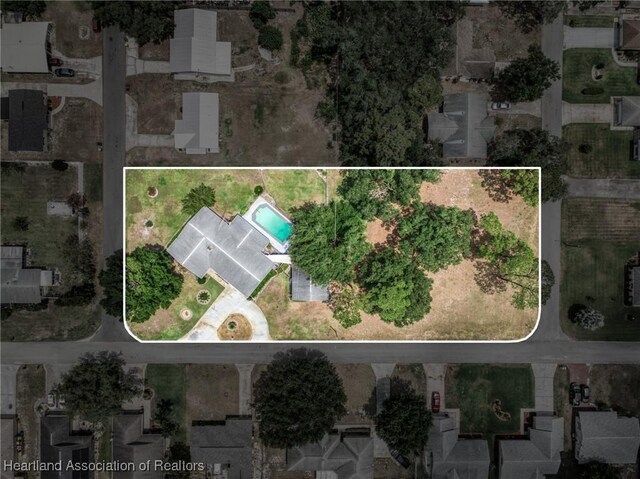 302 S Egret St, Sebring, FL 33870 - aerial view of property and surrounding area featuring property boundaries highlighted