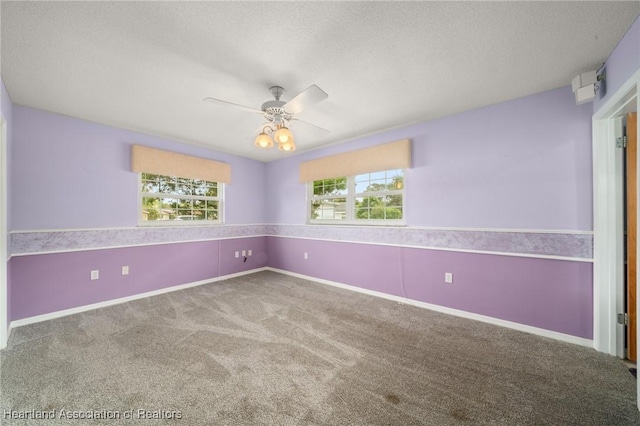 302 S Egret St, Sebring, FL 33870 - spare room with carpet, a ceiling fan, a textured ceiling, and baseboards