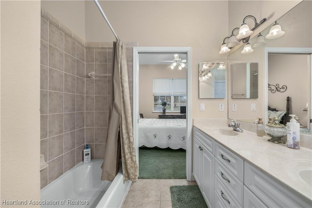 bathroom featuring tile patterned floors, vanity, and shower / bath combo