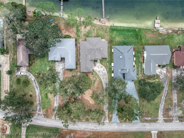 back of property featuring a sunroom, a patio, and a lawn