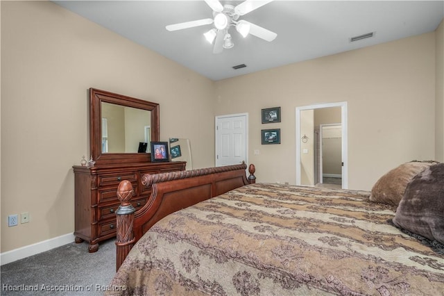 bedroom with ensuite bathroom, carpet, and ceiling fan