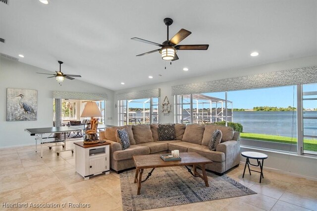 living room featuring light tile patterned floors, baseboards, ceiling fan, and recessed lighting