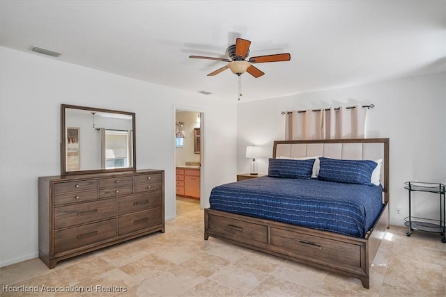 bedroom featuring ceiling fan, visible vents, and ensuite bathroom