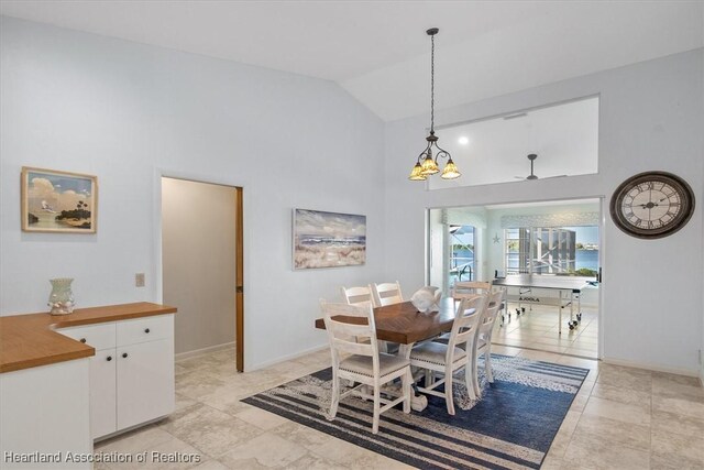 dining space featuring baseboards, high vaulted ceiling, ceiling fan, and light tile patterned floors