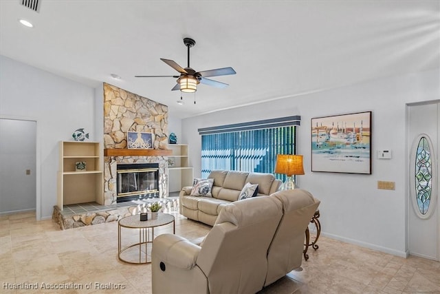 living area featuring visible vents, lofted ceiling, baseboards, a stone fireplace, and ceiling fan