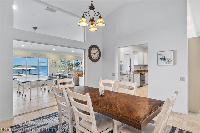 dining area with visible vents, baseboards, light tile patterned floors, and a chandelier