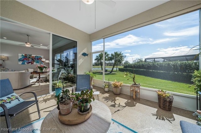 sunroom featuring ceiling fan