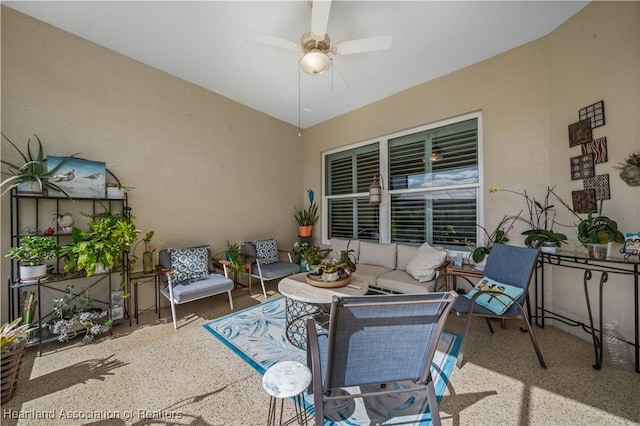 view of patio with ceiling fan and an outdoor hangout area