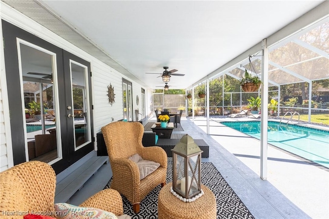 view of pool with ceiling fan, a patio, a lanai, fence, and a fenced in pool