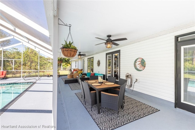 view of patio / terrace featuring a lanai, ceiling fan, and an outdoor pool